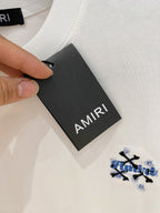 AMIRI Skull Crossbones Chest Graphic Crew Neck Short‑Sleeve T‑Shirt