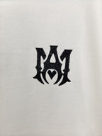 AMIRI Gothic Monogram Chest Graphic Crew Neck Short‑Sleeve T‑Shirt