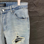 AMIRI Black Ribbed Patch Distressed Slim‑Fit Denim Jeans