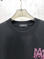 AMIRI Gothic Monogram Chest Graphic Crew Neck Short‑Sleeve T‑Shirt