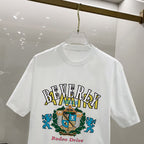 AMIRI Beverly Hills Rodeo Drive Crest Graphic Crew Neck Short‑Sleeve T‑Shirt