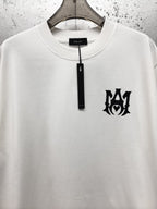 AMIRI Gothic Monogram Chest Graphic Crew Neck Short‑Sleeve T‑Shirt