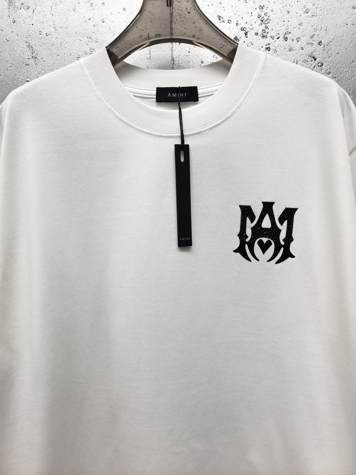 AMIRI Gothic Monogram Chest Graphic Crew Neck Short‑Sleeve T‑Shirt