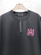 AMIRI Gothic Monogram Chest Graphic Crew Neck Short‑Sleeve T‑Shirt