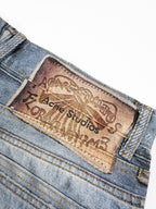 Acne Studios Patchwork Distressed Wide‑Leg Denim Trousers