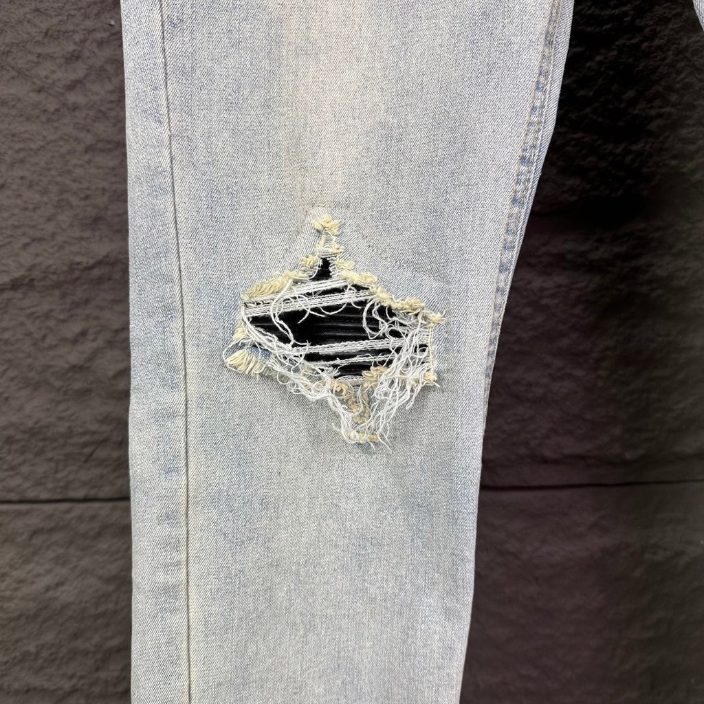 AMIRI Black Ribbed Patch Distressed Slim‑Fit Denim Jeans