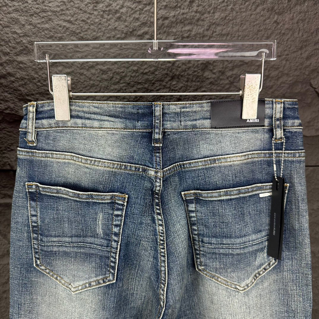 AMIRI Ripped Ribbed Patch Slim‑Fit Denim Jeans